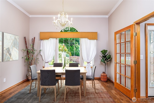 6841 NW Ranger Way, Silverdale, WA 98383 - dining space featuring a chandelier, wood finished floors, ornamental molding, and baseboards