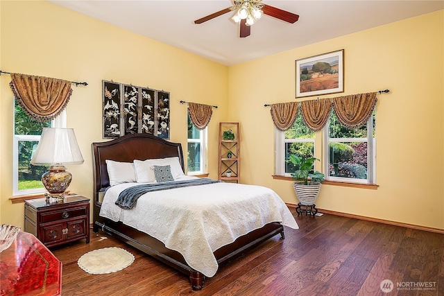 6841 NW Ranger Way, Silverdale, WA 98383 - bedroom with multiple windows, wood finished floors, and baseboards