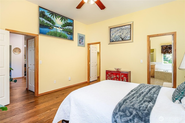 6841 NW Ranger Way, Silverdale, WA 98383 - bedroom with wood finished floors, ensuite bathroom, and ceiling fan
