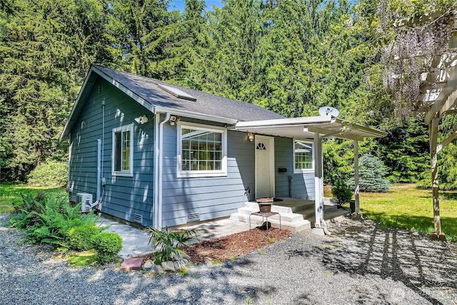 6841 NW Ranger Way, Silverdale, WA 98383 - bungalow-style home featuring roof with shingles, a view of trees, and crawl space