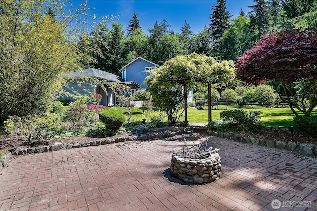 6841 NW Ranger Way, Silverdale, WA 98383 - view of patio / terrace with a fire pit