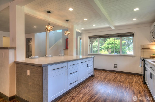 872 Albion Ave SE, Ocean Shores, WA 98569 - kitchen featuring dark wood-type flooring, white cabinets, baseboards, pendant lighting, and recessed lighting