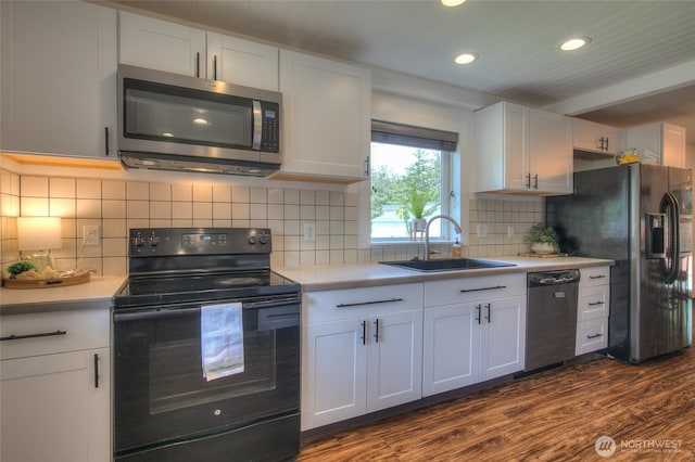 872 Albion Ave SE, Ocean Shores, WA 98569 - kitchen with black appliances, a sink, light countertops, recessed lighting, and dark wood finished floors
