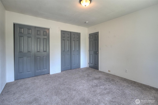 872 Albion Ave SE, Ocean Shores, WA 98569 - unfurnished bedroom with carpet floors and multiple closets