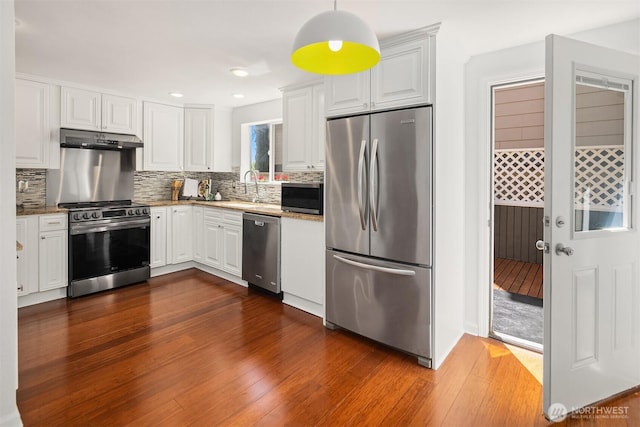 379 100th Ave NE Unit A, Bellevue, WA 98004 - kitchen with appliances with stainless steel finishes, a sink, white cabinetry, under cabinet range hood, and recessed lighting