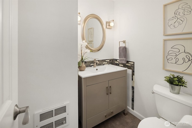 379 100th Ave NE Unit A, Bellevue, WA 98004 - half bathroom featuring toilet, vanity, backsplash, heating unit, and tile patterned flooring