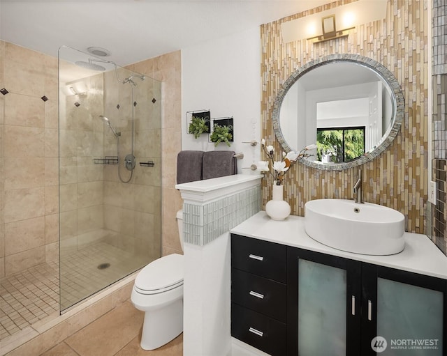 379 100th Ave NE Unit A, Bellevue, WA 98004 - bathroom with a stall shower, vanity, toilet, tile patterned floors, and tile walls