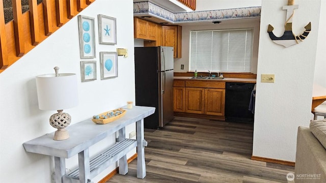 1249 E Ocean Shores Blvd SW, Ocean Shores, WA 98569 - kitchen with brown cabinets, freestanding refrigerator, dark wood-type flooring, and black dishwasher
