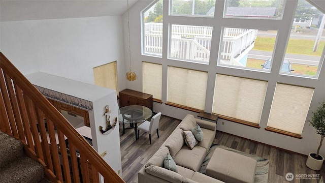 1249 E Ocean Shores Blvd SW, Ocean Shores, WA 98569 - living area with wood finished floors, a high ceiling, and stairway