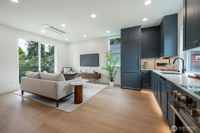 3639 34th Ave W Unit B, Seattle, WA 98199 - living area with light wood-type flooring, recessed lighting, and baseboards