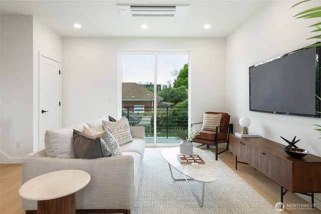 3639 34th Ave W Unit B, Seattle, WA 98199 - living room featuring healthy amount of natural light, light wood-style floors, and recessed lighting