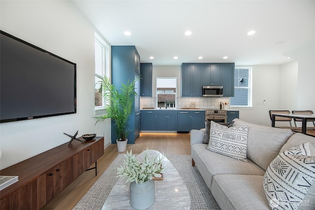 3639 34th Ave W Unit B, Seattle, WA 98199 - living area featuring light wood-type flooring and recessed lighting