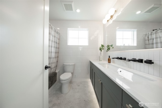 3639 34th Ave W Unit B, Seattle, WA 98199 - bathroom featuring tile walls, vanity, and toilet
