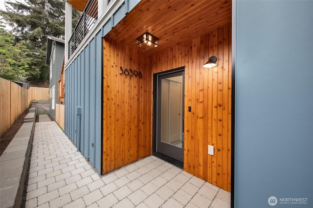 3639 34th Ave W Unit B, Seattle, WA 98199 - view of exterior entry featuring a patio area and board and batten siding