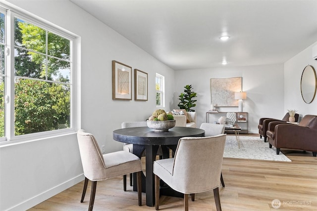 4126 19th Ave SW, Seattle, WA 98106 - dining room with light wood finished floors and baseboards