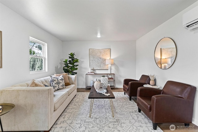 4126 19th Ave SW, Seattle, WA 98106 - living room featuring a wall unit AC, light wood-style flooring, and baseboards
