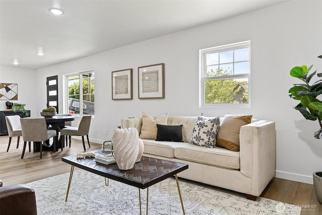 4126 19th Ave SW, Seattle, WA 98106 - living room featuring light wood-style floors, baseboards, and recessed lighting