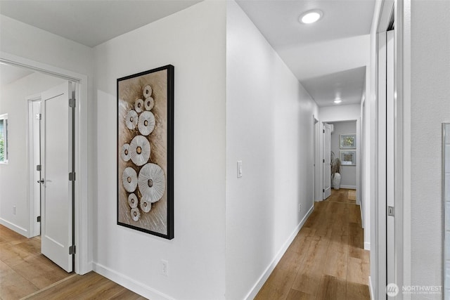 4126 19th Ave SW, Seattle, WA 98106 - hallway featuring light wood-style flooring, baseboards, and recessed lighting
