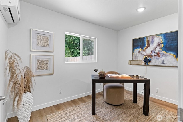 4126 19th Ave SW, Seattle, WA 98106 - office area featuring wood finished floors, a wall unit AC, baseboards, and recessed lighting