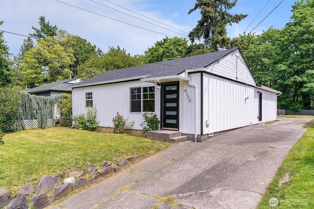 4126 19th Ave SW, Seattle, WA 98106 - view of front facade with asphalt driveway and a shingled roof