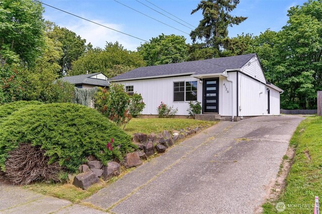 4126 19th Ave SW, Seattle, WA 98106 - view of front facade featuring board and batten siding and a shingled roof