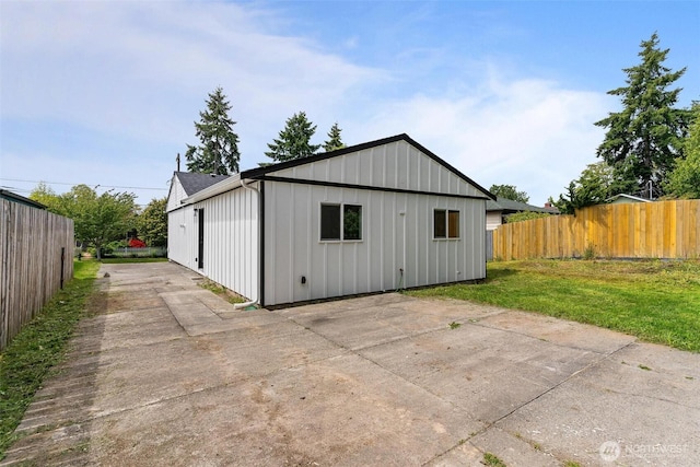 4126 19th Ave SW, Seattle, WA 98106 - exterior space with a patio, board and batten siding, and concrete driveway