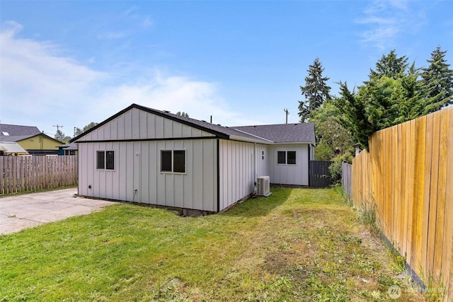 4126 19th Ave SW, Seattle, WA 98106 - rear view of house with a patio, board and batten siding, and central AC unit