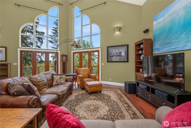 10507 48th St E, Edgewood, WA 98372 - living room featuring a towering ceiling, french doors, baseboards, and wood finished floors