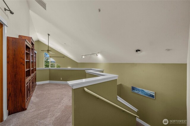 10507 48th St E, Edgewood, WA 98372 - corridor with an upstairs landing, carpet, lofted ceiling, and baseboards