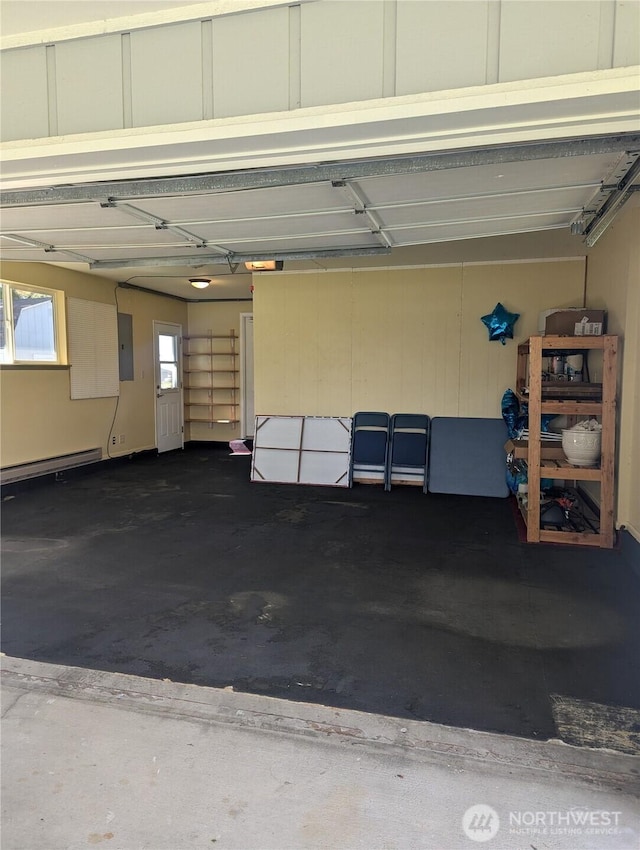 361 E Anderson Rd, Sequim, WA 98382 - garage featuring electric panel and a baseboard radiator