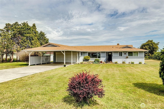 361 E Anderson Rd, Sequim, WA 98382 - ranch-style house with an attached garage, driveway, a carport, and a front yard