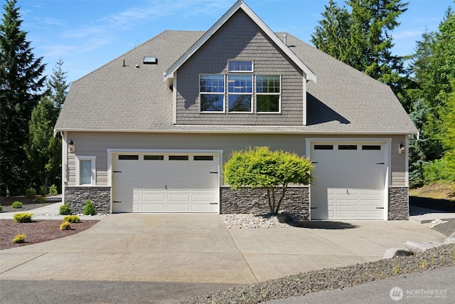 5020 Gold Ridge Ln SW, Olympia, WA 98512 - view of front of house featuring stone siding and concrete driveway