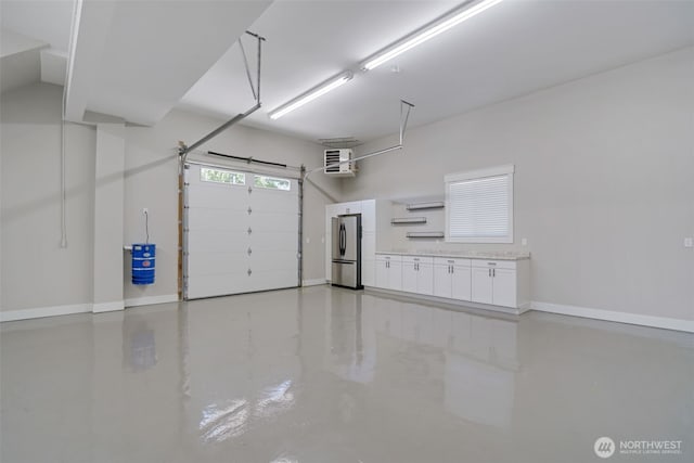 5020 Gold Ridge Ln SW, Olympia, WA 98512 - garage featuring freestanding refrigerator, baseboards, and a heating unit