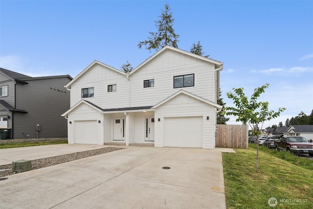 1013 Peach Rd Unit A & B, Winlock, WA 98659 - view of front of house featuring board and batten siding, a garage, and driveway