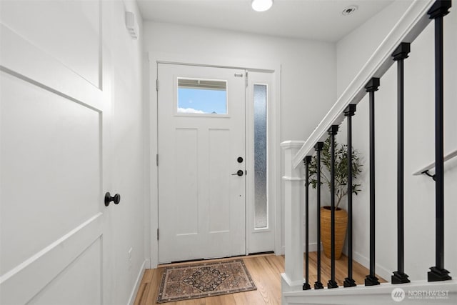 1013 Peach Rd Unit A & B, Winlock, WA 98659 - foyer entrance with wood finished floors, stairway, and baseboards
