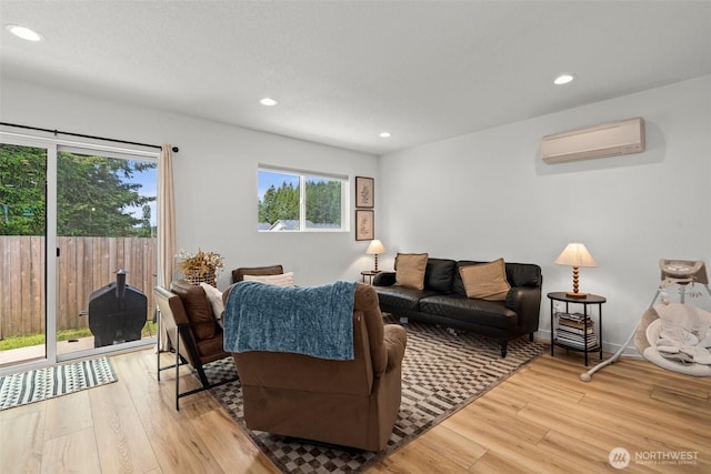 1013 Peach Rd Unit A & B, Winlock, WA 98659 - living area with a wall mounted AC, light wood-style flooring, and recessed lighting