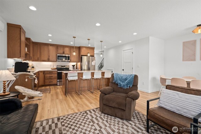 1013 Peach Rd Unit A & B, Winlock, WA 98659 - kitchen with stainless steel appliances, open floor plan, light countertops, recessed lighting, and a breakfast bar