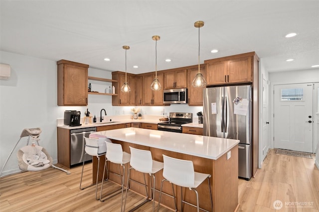 1013 Peach Rd Unit A & B, Winlock, WA 98659 - kitchen with stainless steel appliances, a sink, open shelves, light wood-type flooring, and recessed lighting