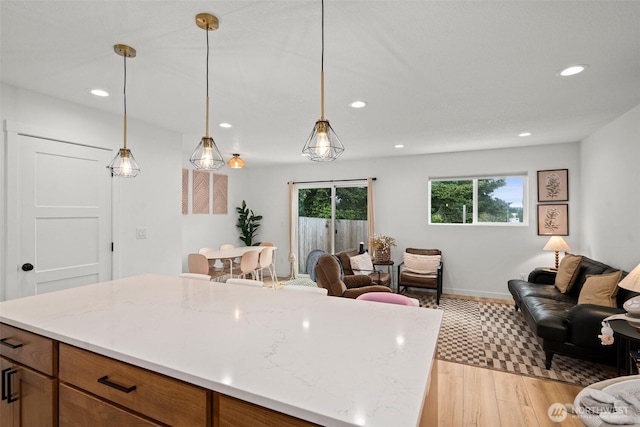 1013 Peach Rd Unit A & B, Winlock, WA 98659 - kitchen with open floor plan, recessed lighting, light wood-style flooring, hanging light fixtures, and baseboards