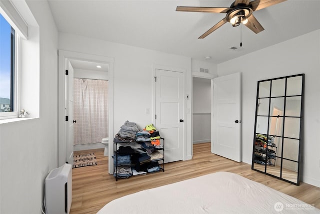 1013 Peach Rd Unit A & B, Winlock, WA 98659 - bedroom with wood finished floors, connected bathroom, and a ceiling fan