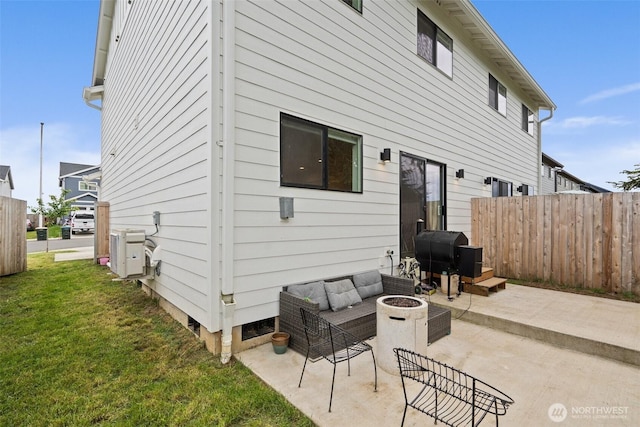 1013 Peach Rd Unit A & B, Winlock, WA 98659 - back of property featuring a patio and an outdoor living space with a fire pit
