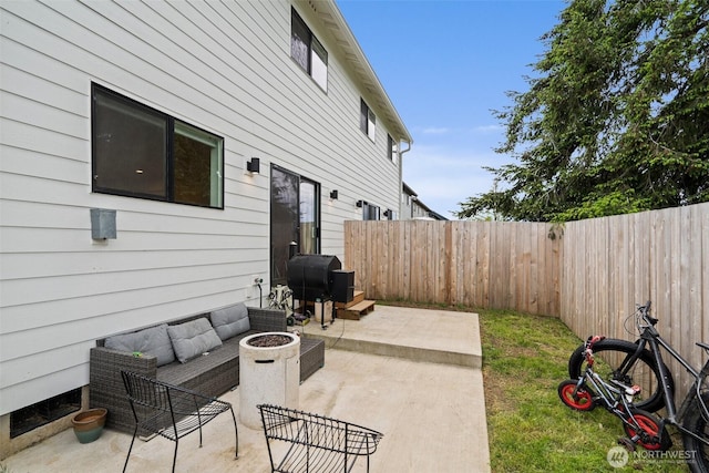 1013 Peach Rd Unit A & B, Winlock, WA 98659 - fenced backyard with a patio area, grilling area, and an outdoor living space with a fire pit