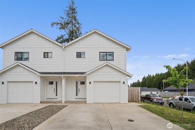 1013 Peach Rd Unit A & B, Winlock, WA 98659 - view of front of home featuring board and batten siding, an attached garage, and concrete driveway