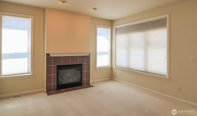 1494 Eastmont Ave Unit 58, East Wenatchee, WA 98802 - unfurnished living room featuring carpet flooring and a tiled fireplace