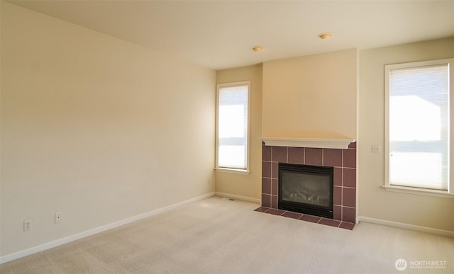 1494 Eastmont Ave Unit 58, East Wenatchee, WA 98802 - unfurnished living room with carpet and a tile fireplace