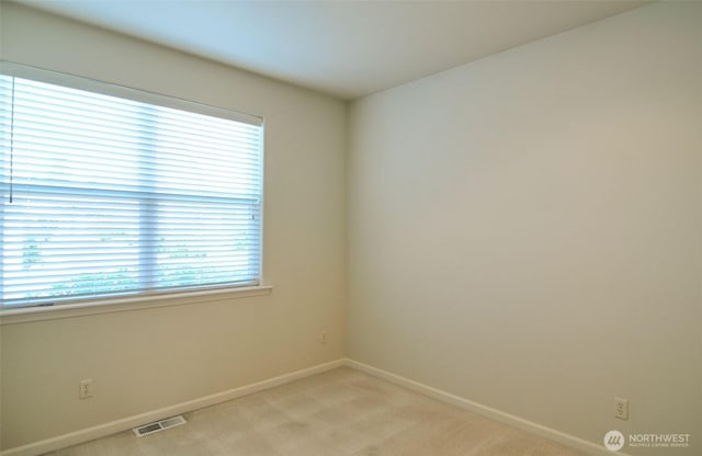 1494 Eastmont Ave Unit 58, East Wenatchee, WA 98802 - unfurnished room with baseboards and light colored carpet