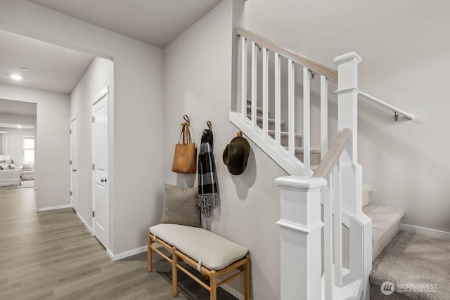 768 SE 11th Pl Lot 05, North Bend, WA 98045 - staircase featuring baseboards and wood finished floors