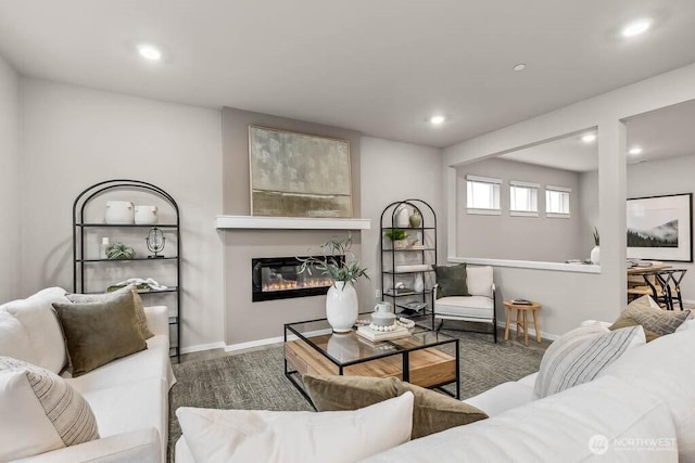 768 SE 11th Pl Lot 05, North Bend, WA 98045 - living room featuring recessed lighting, a glass covered fireplace, and baseboards