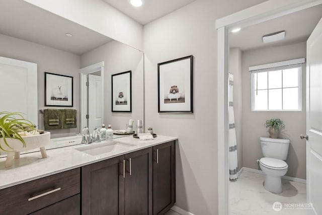768 SE 11th Pl Lot 05, North Bend, WA 98045 - bathroom with marble finish floors, vanity, baseboards, toilet, and recessed lighting