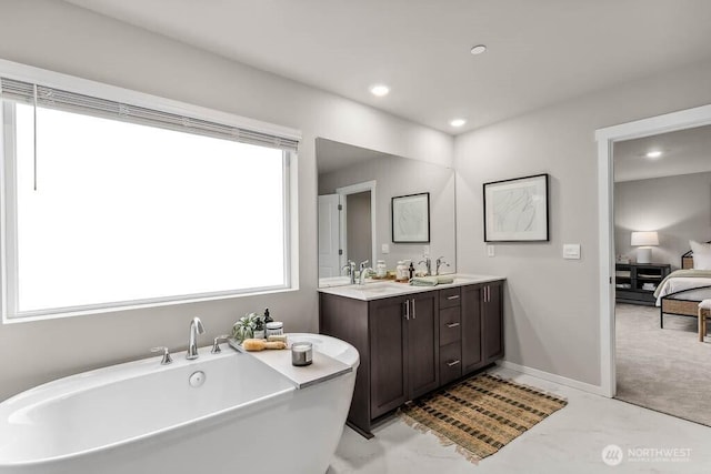 768 SE 11th Pl Lot 05, North Bend, WA 98045 - ensuite bathroom with a freestanding bath, double vanity, and recessed lighting